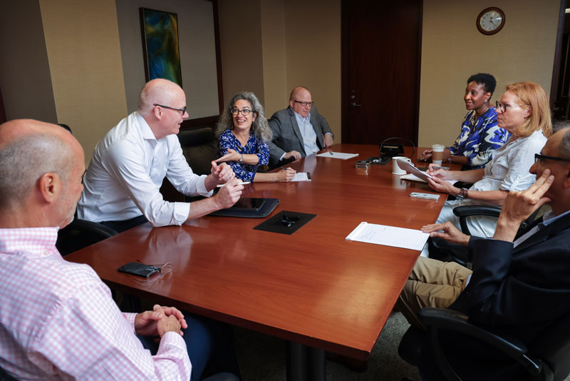 fuqua leaders sitting around a table