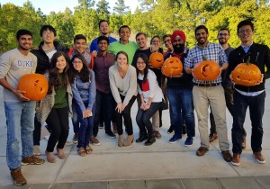 Students holding carved pumpkins for Halloween