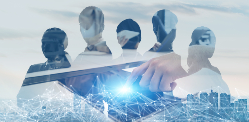 silhouettes of professional with illustration of digital grid in the foreground