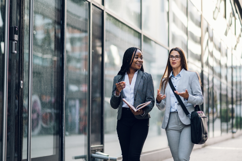 professionals walking in city environment