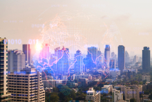 digital globe superimposed over cityscape