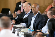 Fuqua Alumni sitting at a summit table