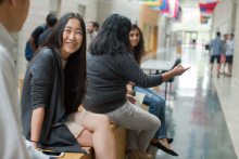 Fuqua Daytime MBA student sitting in the mallway