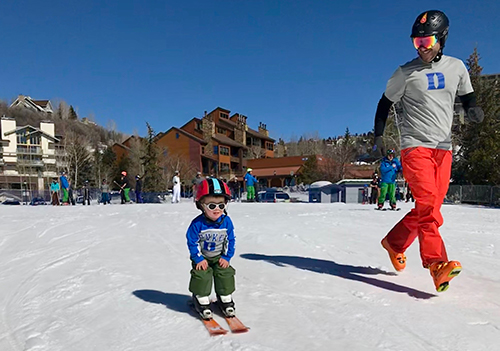 Chris and son skiing