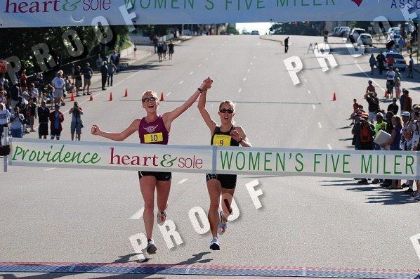 Runners crossing finish line