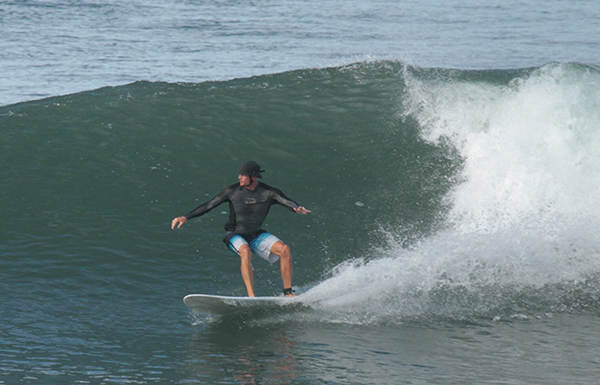 Kelly Dyer surfing