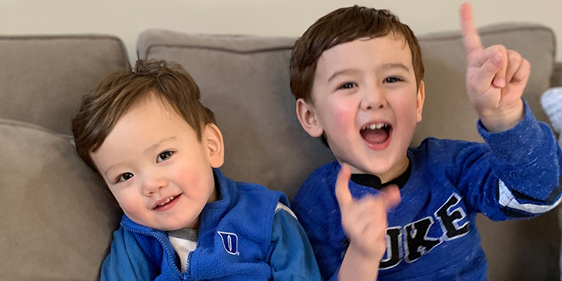 Jackson and Derek cheering for Duke