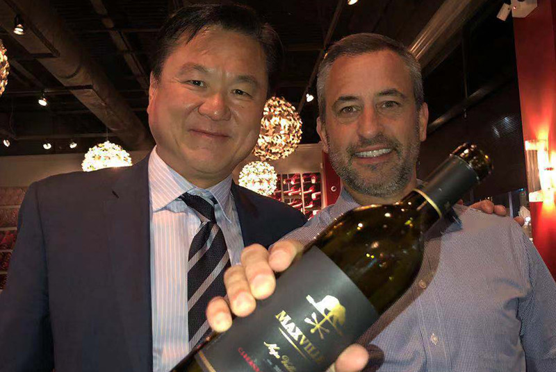 Anthony Hsu and Dave Lane with Maxville wine bottle